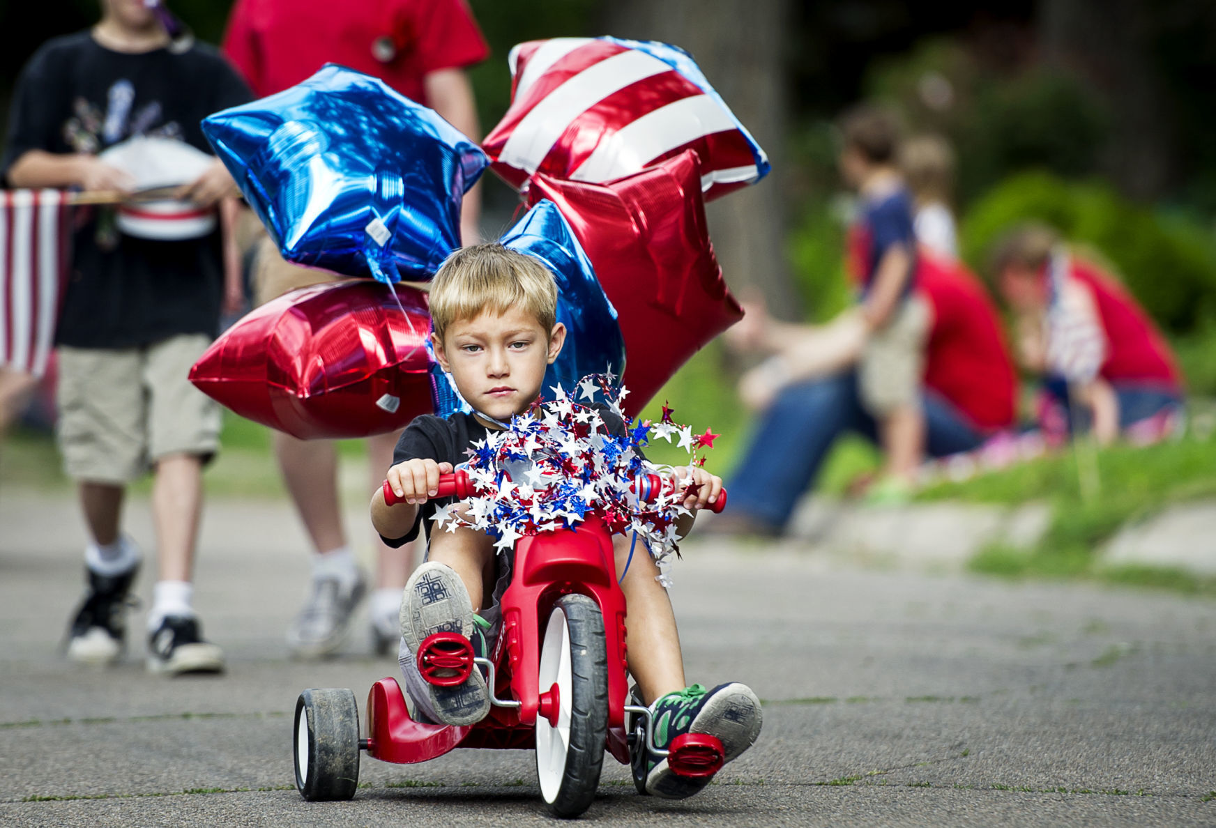 5-year-old rides trike in parade, 2014